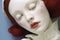 close-up of delicate porcelain doll head, unpainted