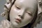 close-up of delicate porcelain doll head, unpainted