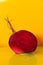 Close up of a delicious beetroot cut in half on yellow background