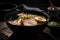 close-up of delicious bowl of tonkotsu ramen with steamy broth, slices of pork, and spring onion