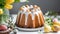 Close-up of delicious Easter bundt cake with white glazing on white table. Tasty holiday dessert