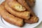 Close-up of delicious freshly made churros. Fried batons.