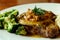 Close up of delicious grilled pork chops with mash potato and steamed green broccoli