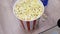 Close up of delicious popcorn in a bucket, concept of cinema and food.