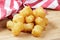 Close up of delicious Tater Tots on a wooden background