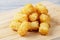 Close up of delicious Tater Tots on a wooden background
