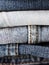 Close up of denim clothes or jeans pile