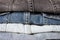 Close up of denim clothes or jeans pile