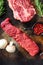 Close up denver steak cutwith set of different alternative types of raw beef steaks on a rustic metall background top view layflat