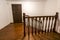 Close-up detail of brown wooden oak stairs in new renovated house. Staircase between two floors.