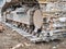 Close up detail with chain tracks of a bulldozer on a demolition site