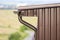 Close-up detail of cottage house corner with metal planks siding