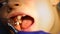 Close-up detail of dentist doctor doing professional cleaning dental plaque and polishing child`s teeth at stomatology