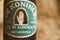 Close-up and detail of dirty and dusty vintage De Koninck beer bottle label