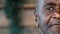 Close up detail half face human sad eyesight male portrait african american adult mature grandpa senior man businessman
