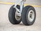 Close up detail with a landing gear of a airplane. Aircraft tires wheels