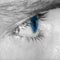 Close up detail of a mans blue eye
