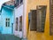 Close up detail with old colorful painted homes and wooden windows shutters in the Sighisoara Citadel, Romania