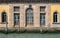 Close up detail with old medieval building architecture venetian window and entrance door