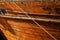 A close up detail of an old wooden Dhow boat