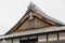 Close up detail roof of Edo period architecture style with leaves less tree in Noboribetsu Date JIdaimura Historic Village.