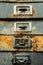 Close up detail of rusty old fashioned metal file drawers