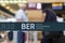 Close-up detail view of BER code Berlin Brandenburg airport logo security barrier tape divider ribbon inside new