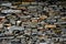 Close-up detail view of an old traditional stone wall built from schist in PiodÃ£o, made of shale rocks stack, one of Portugal\'s