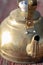 Close up detail of vintage metal tea kettle pour spout