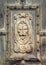 Close up detail from the wooden door entrance to Canterbury Cathedral, Kent, UK