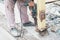 Close up detail of worker drilling holes in steel construction with electric drill