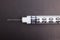 Close-up detailed photograph with copy space emphasizing a insulin syringe lower portion and 29-gauge needle tip