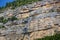 Close up of details of abstract natural stone rock cut texture cross section of weathered granite cliff erosion