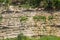 Close up of details of abstract natural stone rock cut texture cross section of weathered granite cliff erosion