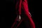 Close-up details of clothing on a woman model in red suit walks on the fashion show