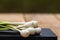 Close up of details of fresh green onions scallion on a cutting board isolated