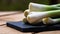 Close up of details of fresh green onions (scallion) on a cutting board isolated