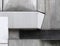 Close up details of geometric grey textured concrete panels on an old brutalist building