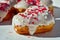 Close-up details of Heart-shaped donuts with tiny red heart sprinkles