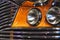 Close-up details of a Maltese bus with headlamps and grill