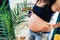 Close up details of pregnant woman in new home - Concept of pregnancy, maternity and motherhood health care, gynaecology, medicine