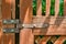 Close up details of vintage steel hinge of wooden door.