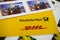 Close up of Deutsche Post and DHL logo with stamps focus on center