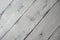 Close-up of diagonal white aged wooden planks