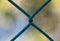 Close up of a diamond mesh fence showing the twisted wire