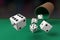 Close-up of dice rolling on a green cloth. 3d illustration