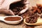 Close-up different types of coffee beans on wooden spoons, anise star, macro, set