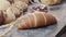 Close-up of  different types of fresh baked Dutch bread is on the wooden table