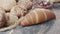 Close-up of  different types of fresh baked Dutch bread is on the wooden table