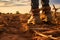 close-up dirty boots of hiker man walking in a muddy path. Unrecognizable person in outdoors activities